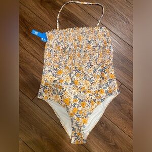 Very cute one piece swimsuit, never worn and still has tag, size large